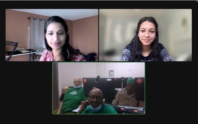 A remote research session: two researchers on a video call with three older adults at a senior center